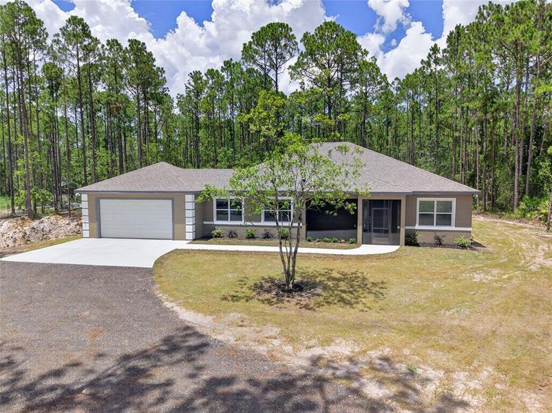 Front exterior of a new home in , Bunnell, FL, highlighting curb appeal (Image 17). Front exterior of a new home in , Bunnell, FL, highlighting curb appeal (Image 17).
