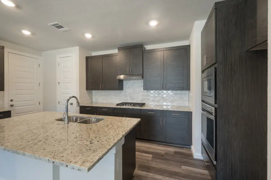 Representative furnished interior of a home built from the Pleasanton by Scott Felder Homes in Flora, Hutto (Image 5).
