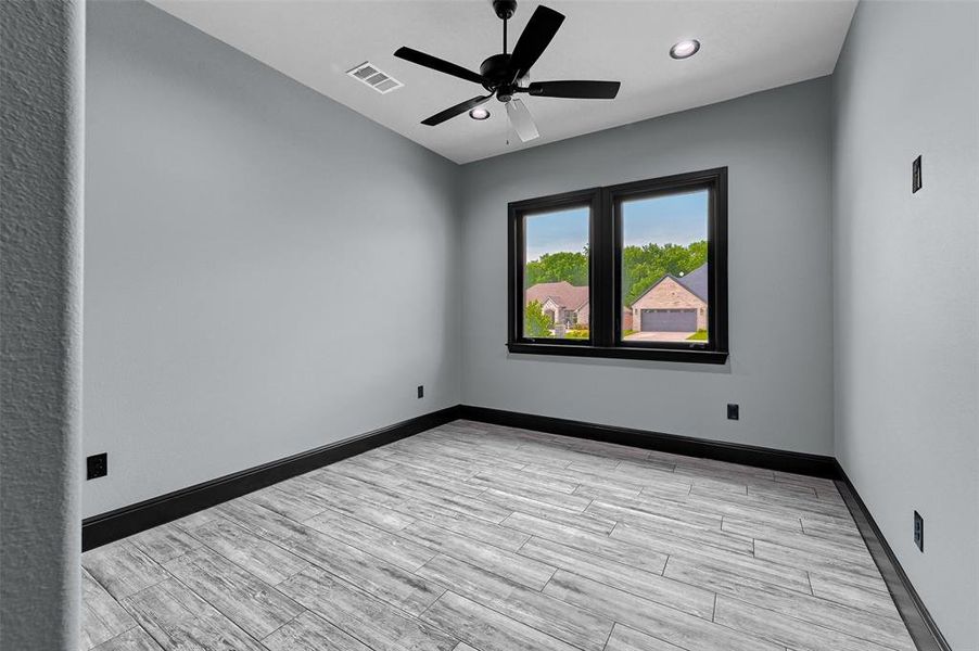 Unfurnished room featuring a ceiling fan, recessed lighting, baseboards, and light wood-style flooring Unfurnished room featuring a ceiling fan, recessed lighting, baseboards, and light wood-style flooring