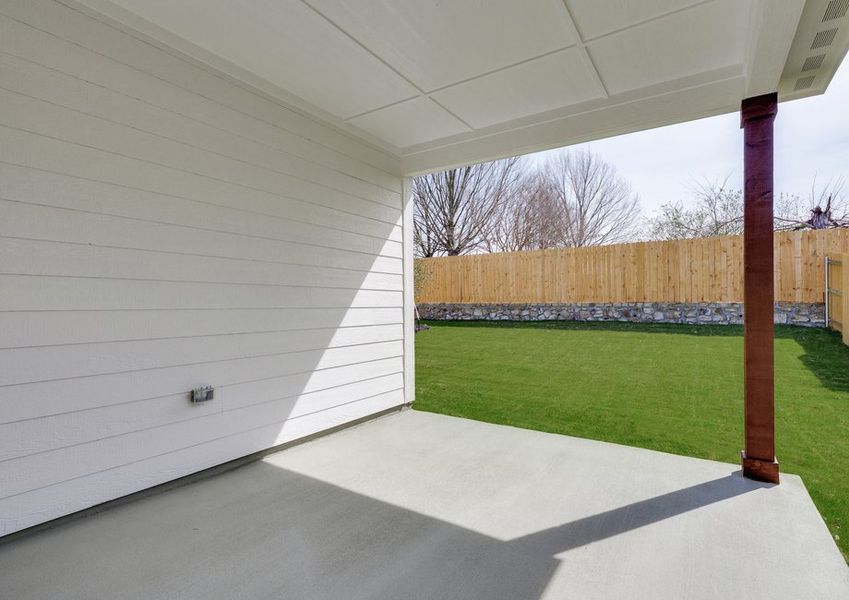 The covered back patio provides a wonderful space for outdoor living.