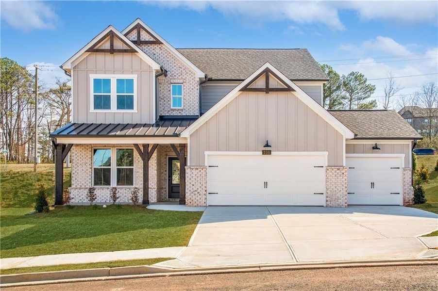 Front exterior of a new home in Hopewell Reserve, Cumming, GA, highlighting curb appeal (Image 1). Front exterior of a new home in Hopewell Reserve, Cumming, GA, highlighting curb appeal (Image 1).