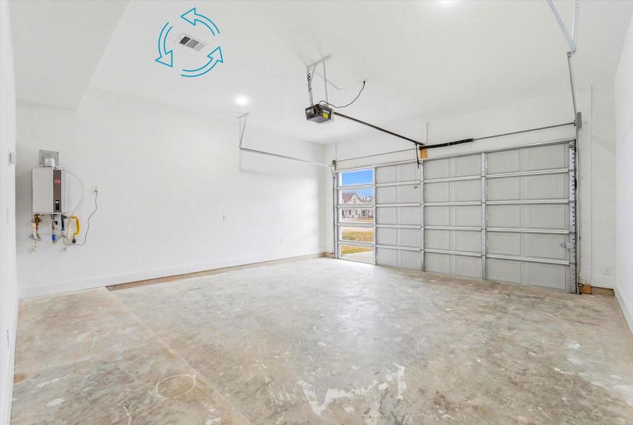 Attached garage equipped with a garage door opener, central A/C components, and a gas tankless water heater for added efficiency and convenience.