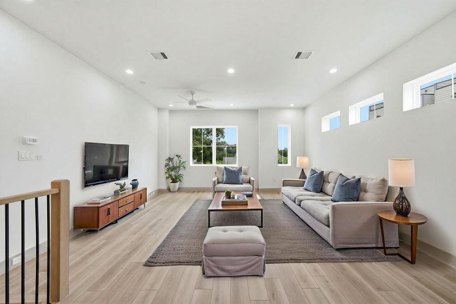 Virtually staged - Walk up to the second floor to the spacious Living Room. Plenty of windows letting in natural light!