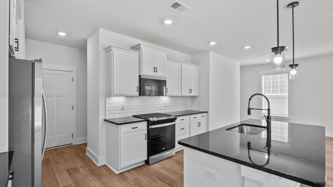 Representative furnished interior of a home built from the Jasmine by DRB Homes in Harrier Point, Woodruff (Image 8).