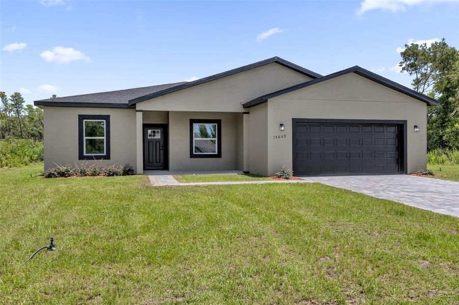 Front exterior of a new home in , Ocala, FL, highlighting curb appeal (Image 22).