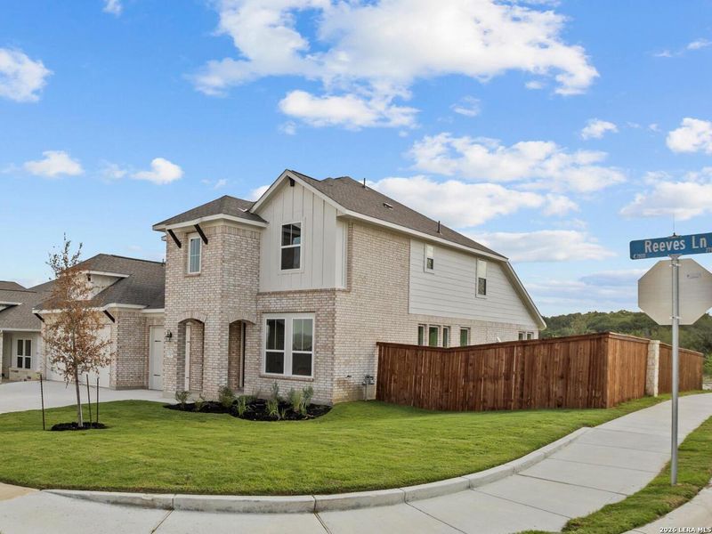 Front exterior of a new home in Homestead, Schertz, TX, highlighting curb appeal (Image 21).
