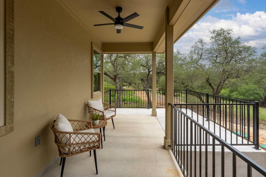 Covered outdoor patio featuring a ceiling fan