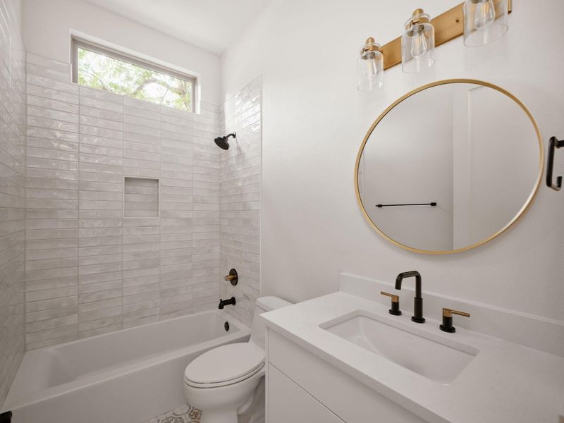 Bathroom featuring shower / tub combination and vanity