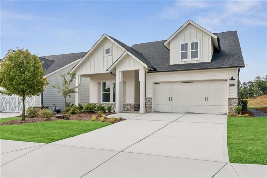 Front exterior of a new home in Crescent Pointe at Great Sky, Canton, GA, highlighting curb appeal (Image 1). Front exterior of a new home in Crescent Pointe at Great Sky, Canton, GA, highlighting curb appeal (Image 1).