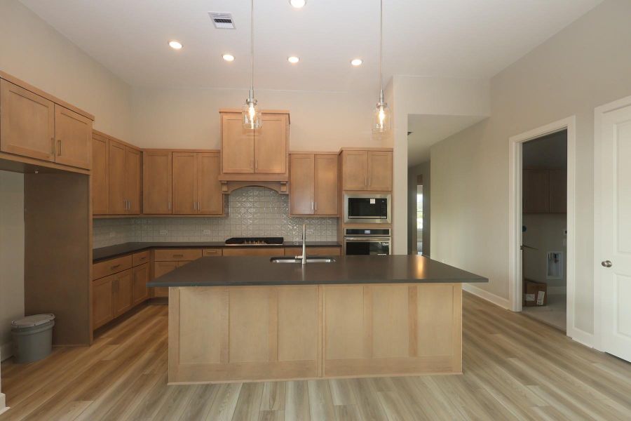 Furnished interior view inside a new home in COLTON - Reserve Collection, Todd Mission (Image 11).