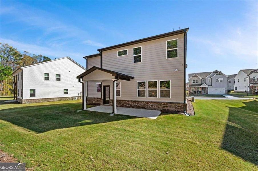 Exterior details and patio area of a home in The Paddocks at Doc Hughes, Buford (Image 3). Exterior details and patio area of a home in The Paddocks at Doc Hughes, Buford (Image 3).