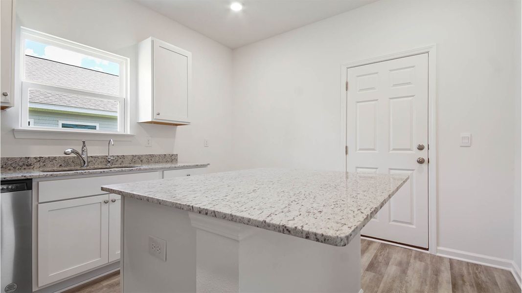 Representative furnished interior of a home built from the Aspen by D.R. Horton in Owl's Head East, Freeport (Image 5).