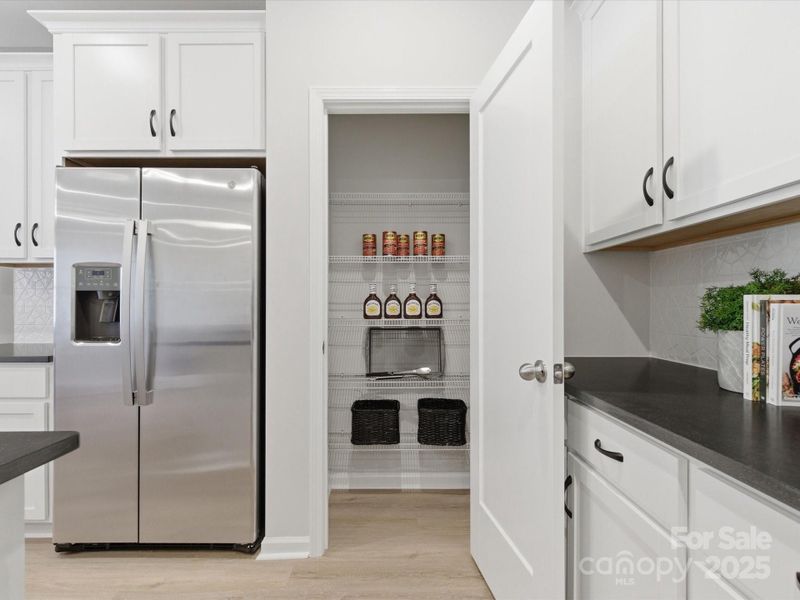 Walk-In Pantry and Convenient Storage Solutions. *Model Photos | Actual Finishes, Structural Selections, and Orientation May Vary.