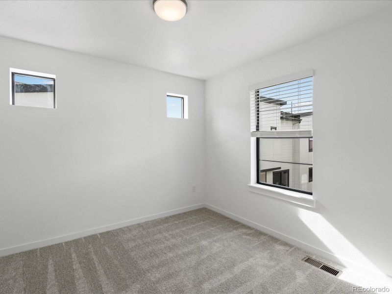 Spacious, unfurnished interior of a new home in The Hub at Virginia Village, Denver (Image 23).