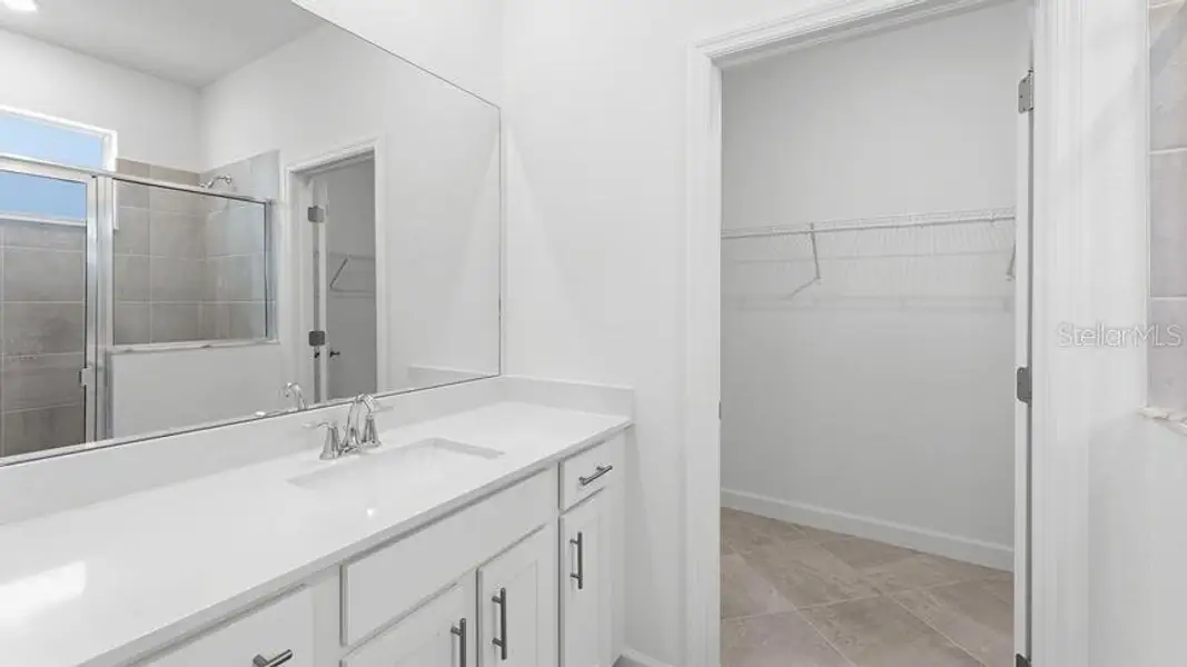 Furnished interior view inside a new home in Palm Lake at Coco Bay, Englewood (Image 9).