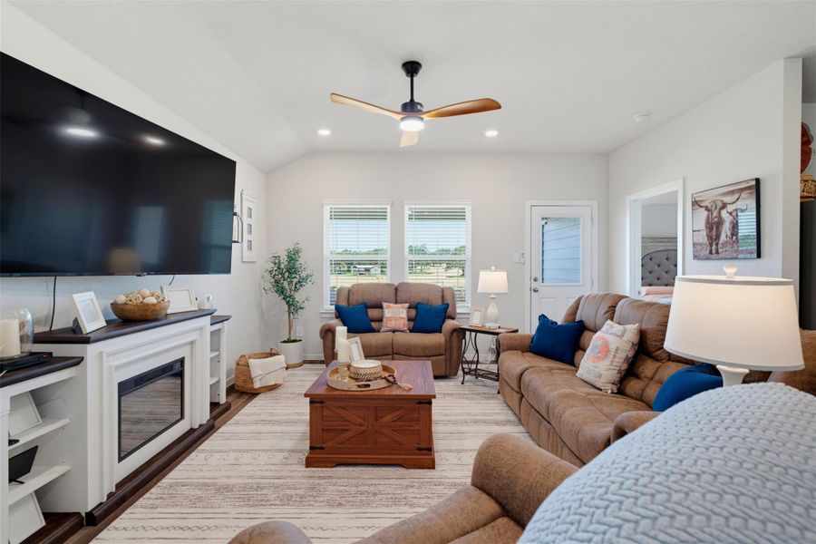 Vaulted ceilings and warm wood floors anchor this comfortable living space. Vaulted ceilings and warm wood floors anchor this comfortable living space.