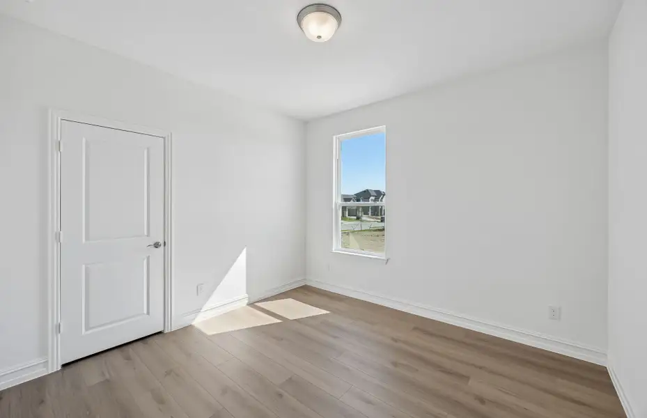 Spacious, unfurnished interior of a new home in Rosemary Fields, Godley (Image 17).