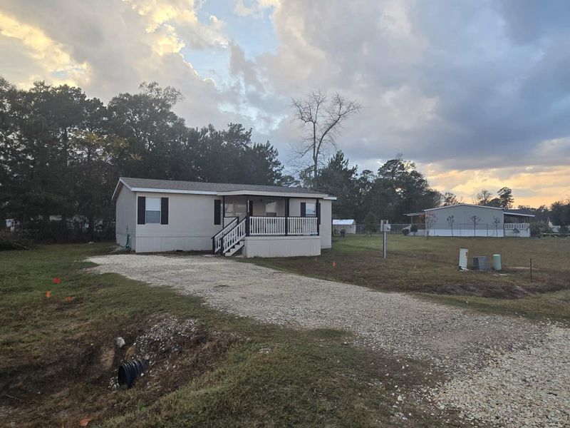 Exterior details and patio area of a home in , Conroe (Image 7). Exterior details and patio area of a home in , Conroe (Image 7).