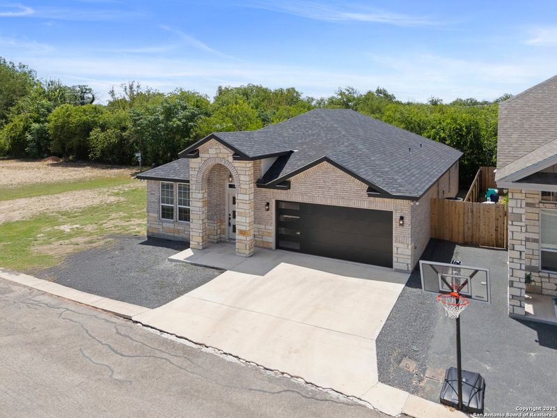 Front exterior of a new home in , Uvalde, TX, highlighting curb appeal (Image 18). Front exterior of a new home in , Uvalde, TX, highlighting curb appeal (Image 18).