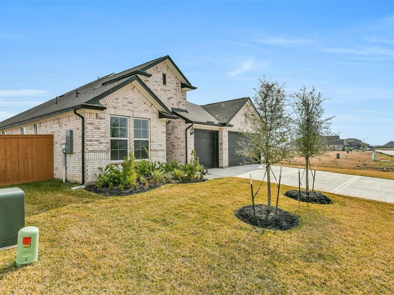 Front exterior of a new home in Lago Mar, Texas City, TX, highlighting curb appeal (Image 23).