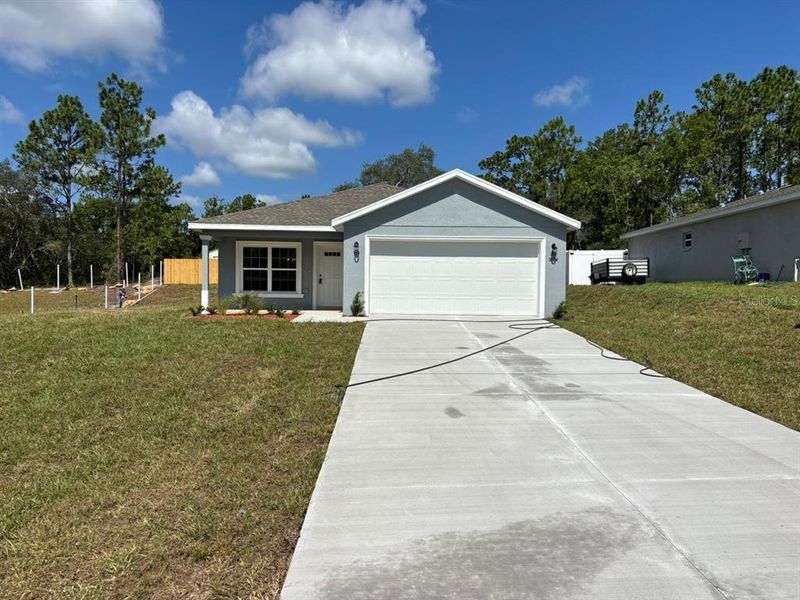 Front exterior of a new home in , Dunnellon, FL, highlighting curb appeal (Image 2). Front exterior of a new home in , Dunnellon, FL, highlighting curb appeal (Image 2).