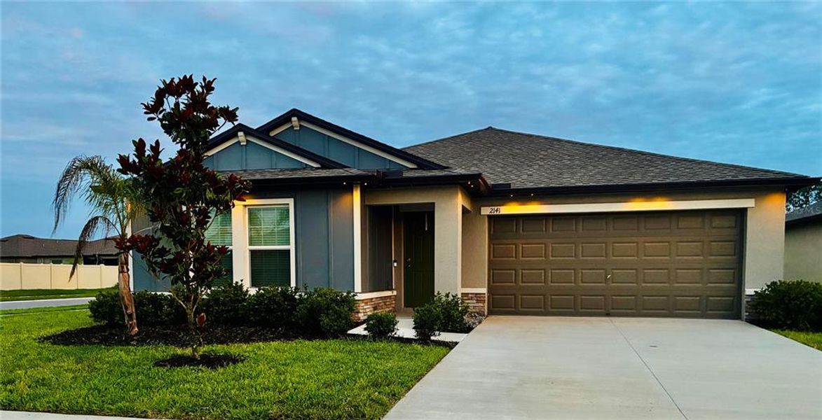 Front exterior of a new home in Two Rivers, Zephyrhills, FL, highlighting curb appeal (Image 19).