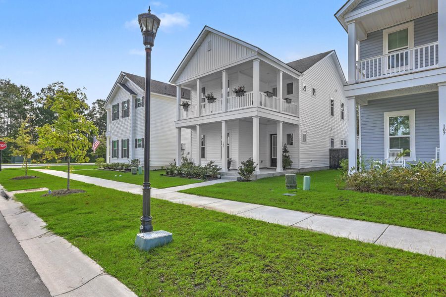 Front exterior of a new home in Limehouse Village: Row Collection, Summerville, SC, highlighting curb appeal (Image 25).