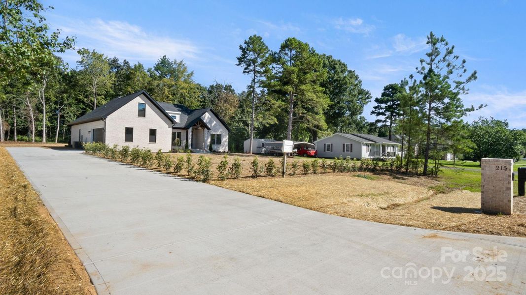 Front exterior of a new home in , Indian Trail, NC, highlighting curb appeal (Image 25). Front exterior of a new home in , Indian Trail, NC, highlighting curb appeal (Image 25).