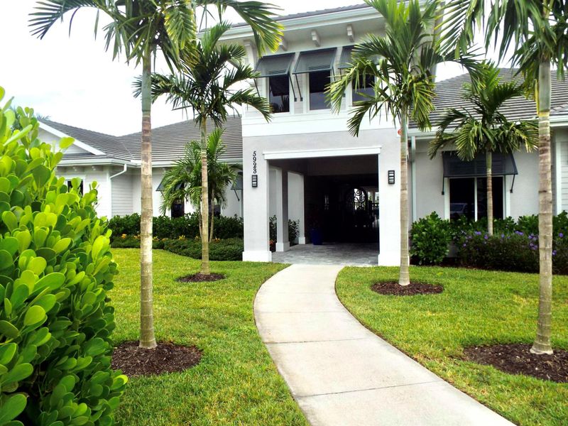 Front exterior of a new home in , Ave Maria, FL, highlighting curb appeal (Image 2).