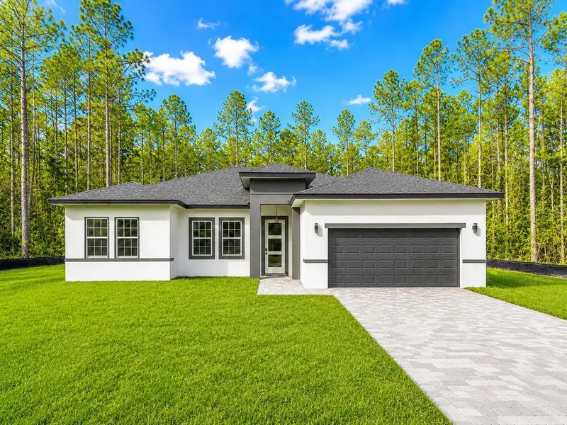 Front exterior of a new home in , Ocala, FL, highlighting curb appeal (Image 19).