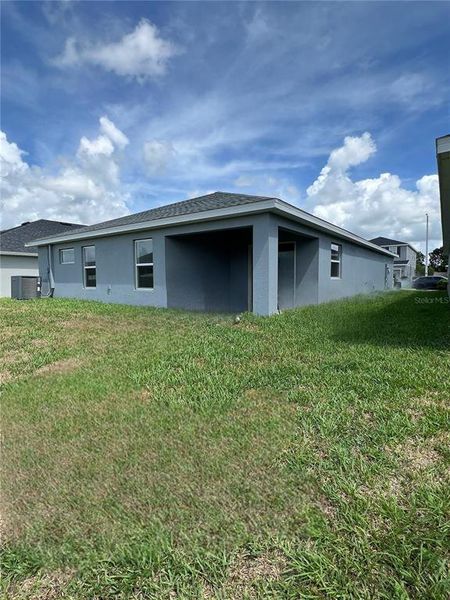 Specious back yard with patio.