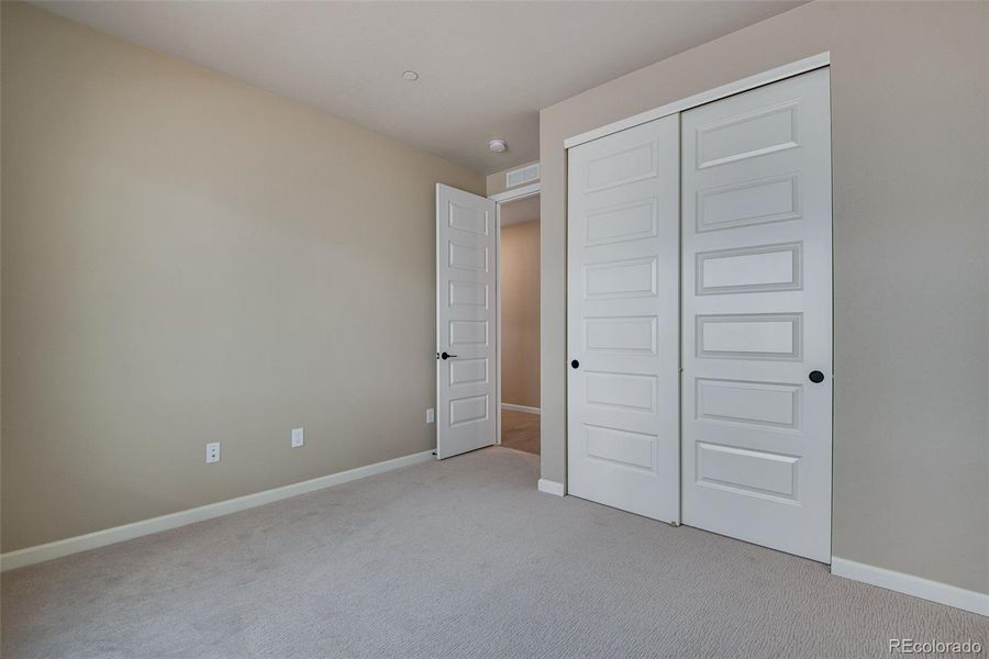 Spacious, unfurnished interior of a new home in Reunion Ridge, Commerce City (Image 36).