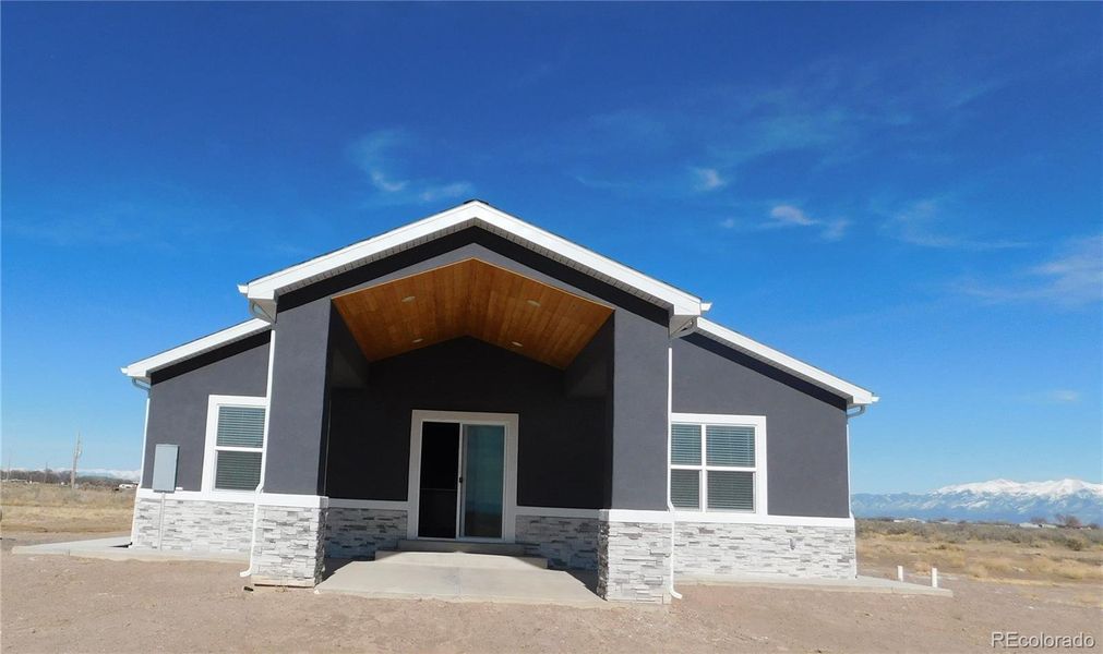 Front exterior of a new home in , Alamosa, CO, highlighting curb appeal (Image 20).