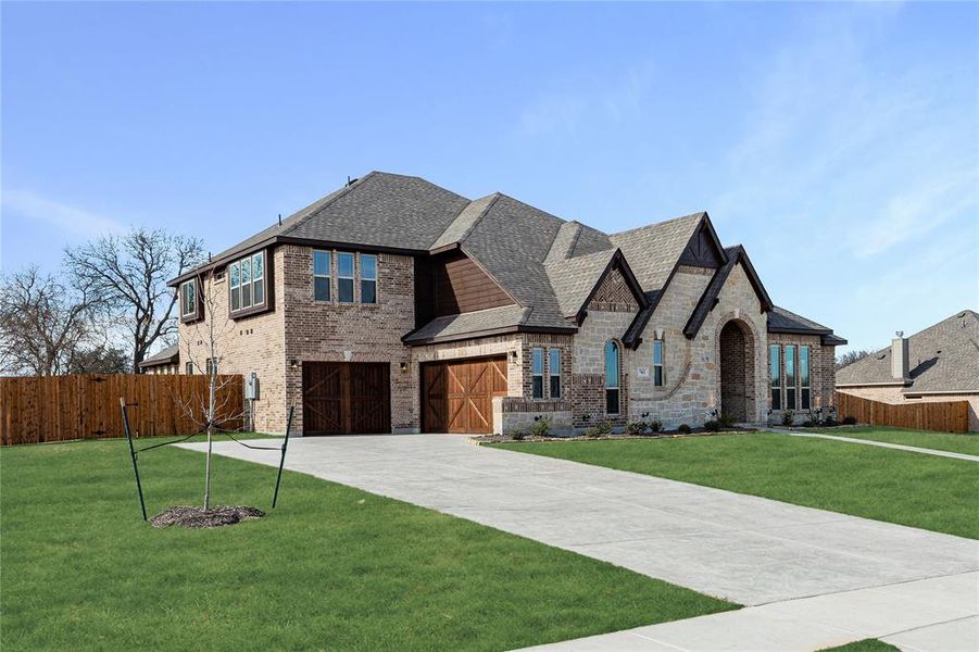 Front exterior of a new home in Crystal Lake Estates, Red Oak, TX, highlighting curb appeal (Image 2).