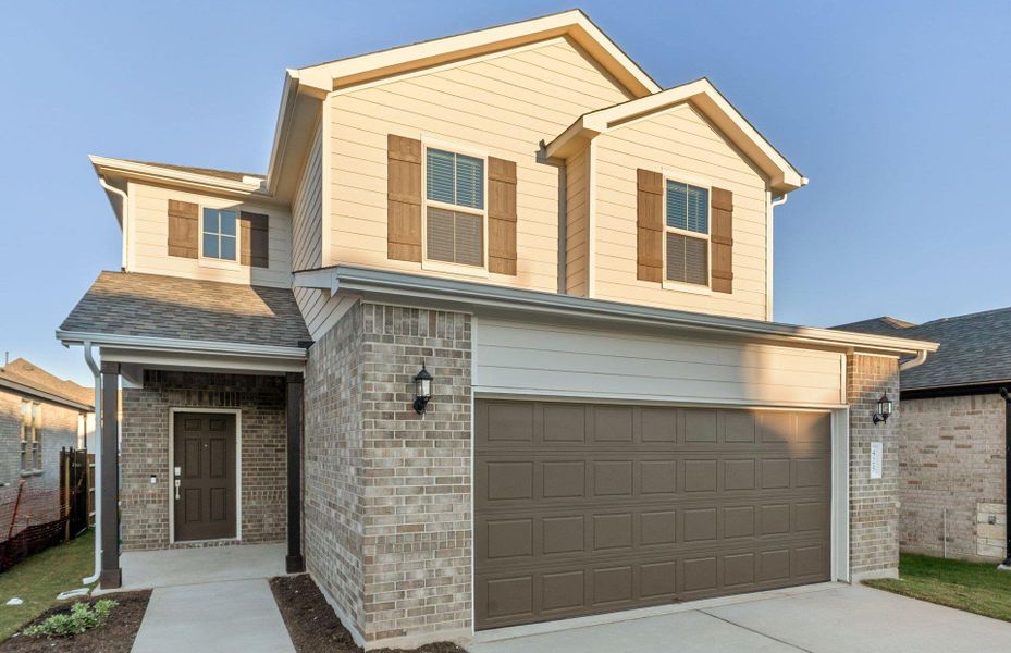 Front exterior of a new home in Saddleback at Santa Rita Ranch, Liberty Hill, TX, highlighting curb appeal (Image 2). Front exterior of a new home in Saddleback at Santa Rita Ranch, Liberty Hill, TX, highlighting curb appeal (Image 2).