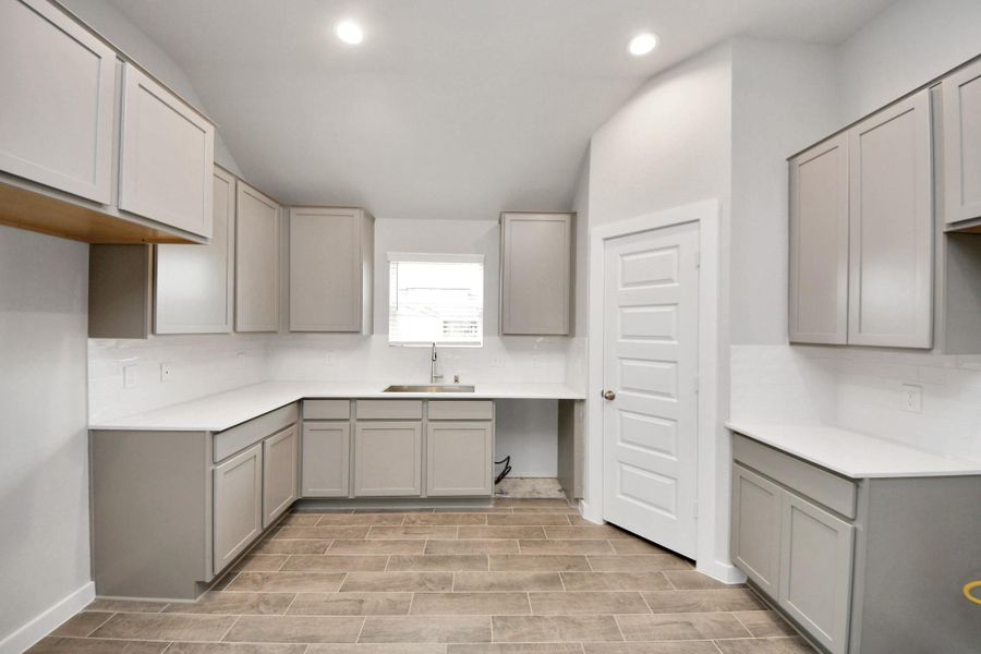 This generously spacious kitchen is a dream realized! Sample photo of completed home with similar floor plan. Actual colors and selections may vary. This generously spacious kitchen is a dream realized! Sample photo of completed home with similar floor plan. Actual colors and selections may vary.
