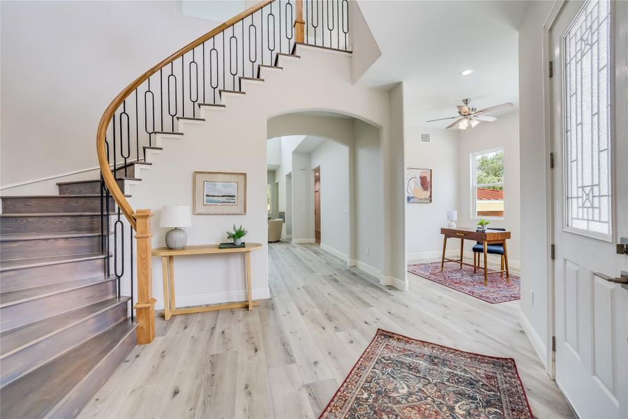 Entryway featuring ceiling fan and light hardwood / wood-style flooring