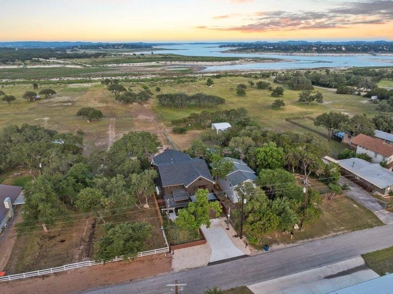 Breathtaking aerial view of your Hill Country escape— from the shores of Canyon Lake. This spacious property offers scenic privacy, wide-open skies, and the perfect blend of lake life and peaceful countryside living.