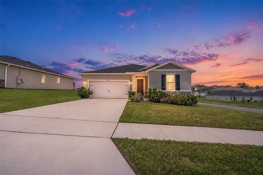 Front exterior of a new home in , Mascotte, FL, highlighting curb appeal (Image 2). Front exterior of a new home in , Mascotte, FL, highlighting curb appeal (Image 2).