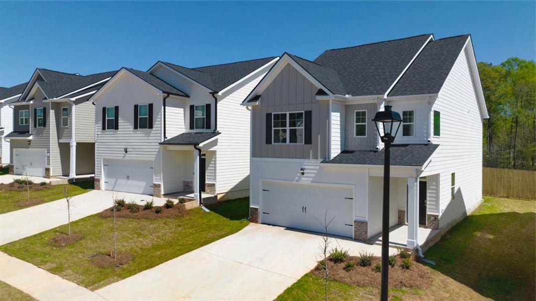 Front exterior of a new home in Shoal Creek, Hampton, GA, highlighting curb appeal (Image 2).