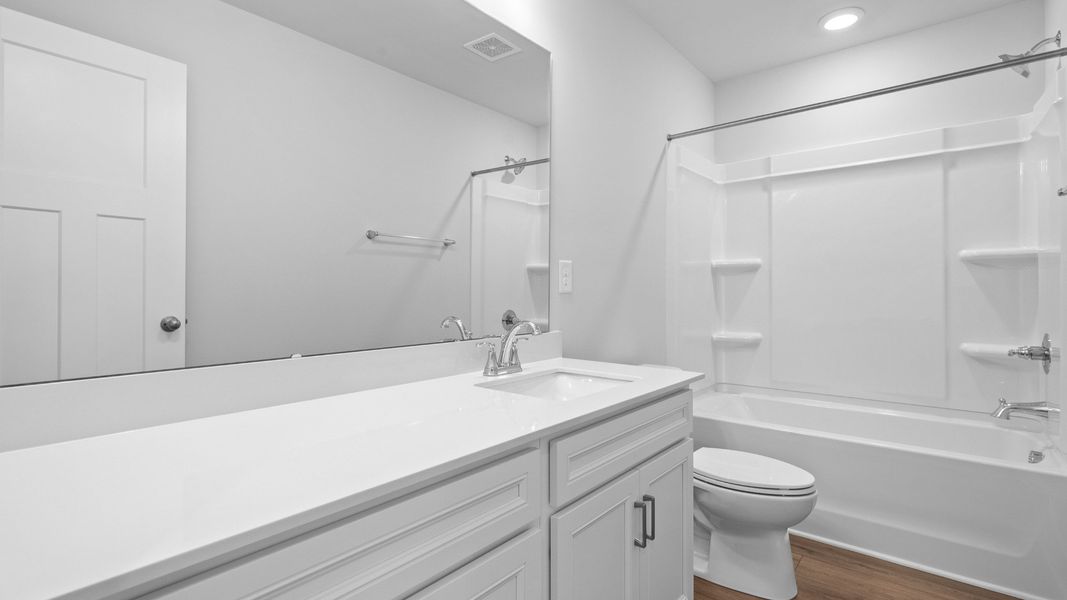 2 story single family home, all white, bathroom