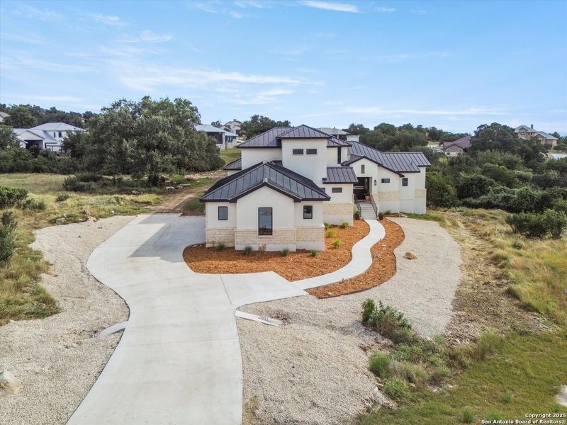 Front exterior of a new home in , New Braunfels, TX, highlighting curb appeal (Image 27). Front exterior of a new home in , New Braunfels, TX, highlighting curb appeal (Image 27).