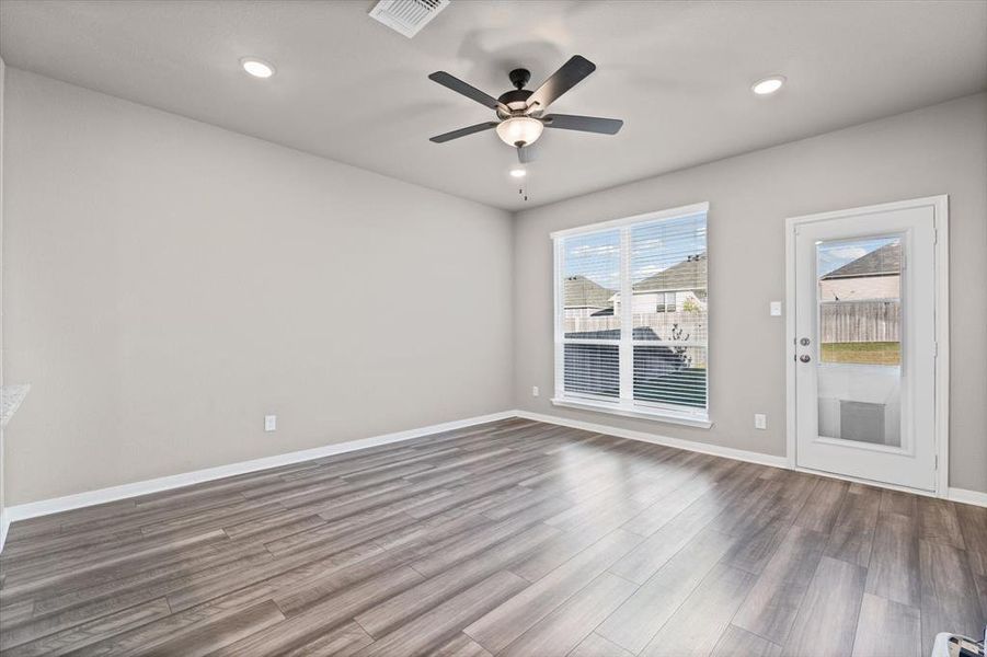 Spare room with wood finished floors, recessed lighting, and a ceiling fan Spare room with wood finished floors, recessed lighting, and a ceiling fan