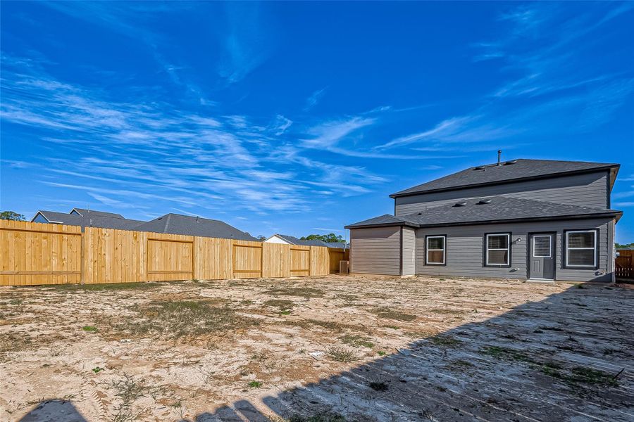Exterior details and patio area of a home in Mill Creek Trails, Magnolia (Image 20).