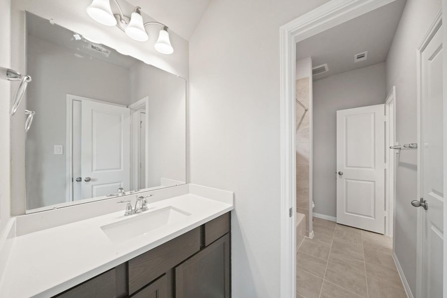 Furnished interior view inside a new home in Bridgeland 55', Cypress (Image 13).