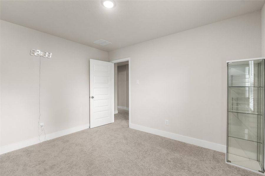 The generous footprint allows this room to comfortably accommodate larger furniture pieces while still leaving ample space for play, study, or relaxation.