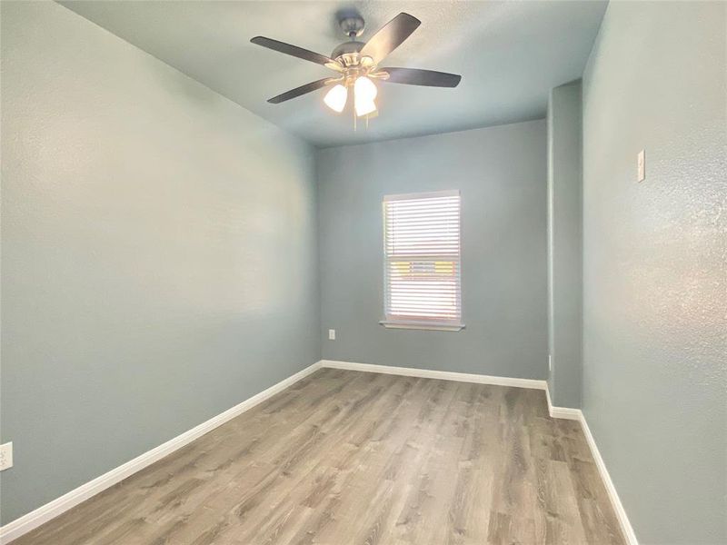 A quiet bedroom offers comfort and a well-lit ambiance, perfect for peaceful repose. A quiet bedroom offers comfort and a well-lit ambiance, perfect for peaceful repose.