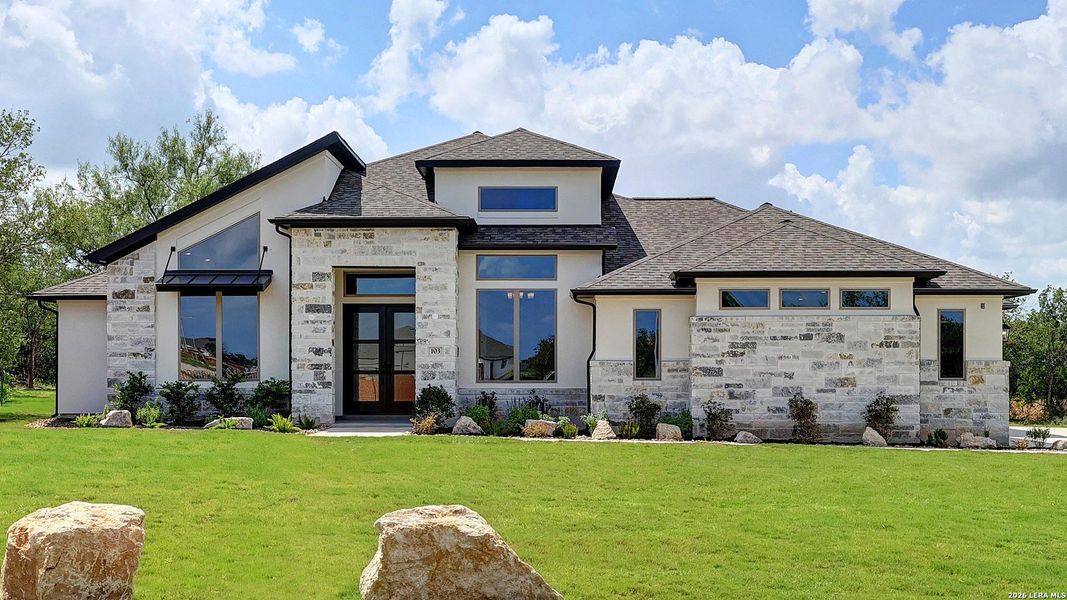 Front exterior of a new home in Megan's Landing, Castroville, TX, highlighting curb appeal (Image 27).