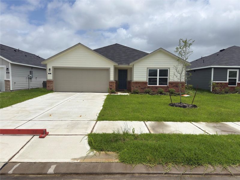 Front exterior of a new home in , Dayton, TX, highlighting curb appeal (Image 2). Front exterior of a new home in , Dayton, TX, highlighting curb appeal (Image 2).