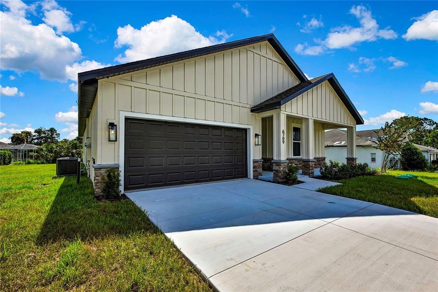Front exterior of a new home in , Spring Hill, FL, highlighting curb appeal (Image 26).